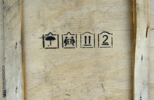 Packaging symbols this way up, keep dry and fragile on wooden bo