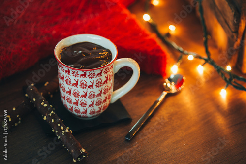 Cup of hot chocolate with Christmas lights photo