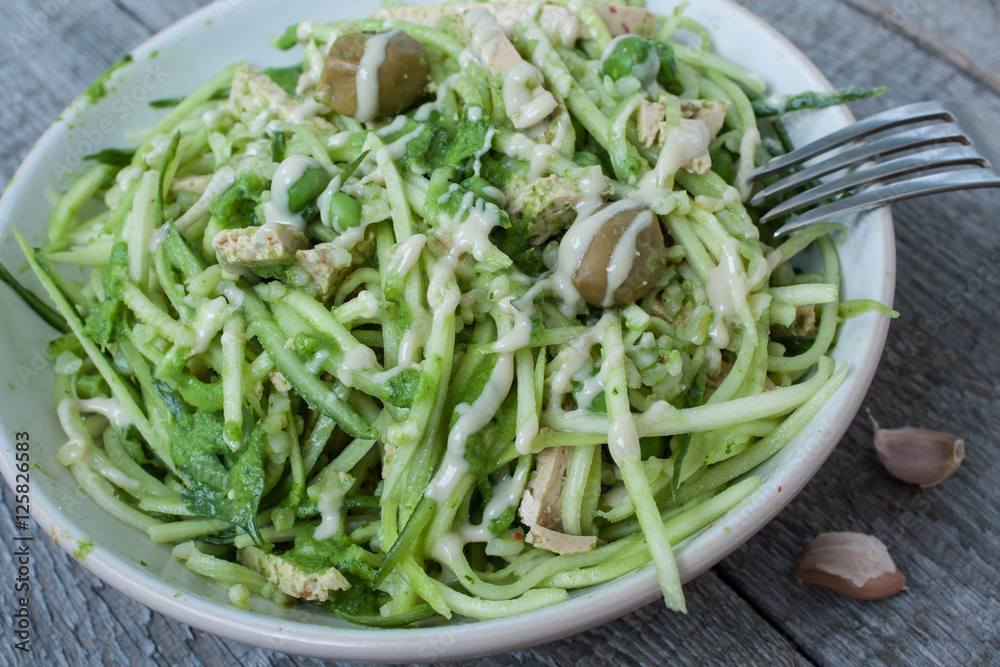 vegan zucchini pasta with tofu, bulgur, green peas, olives and pesto of parsley in a jar. vegetables every day for your health! vegan zucchini pasta with tofu, bulgur, green peas, olives and pesto of parsley in a jar. vegetables every day for your health!