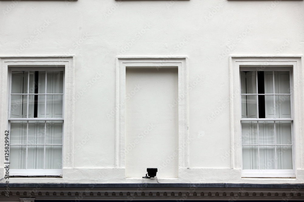 Georgian windows architecture on a wall house, London, UK Georgian windows architecture on a wall house, London, UK