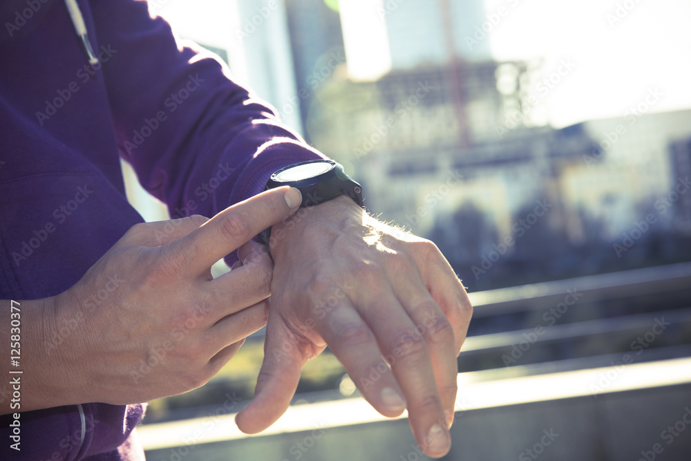 runner man checking heart rate with watch and trainer runner man checking heart rate with watch and trainer