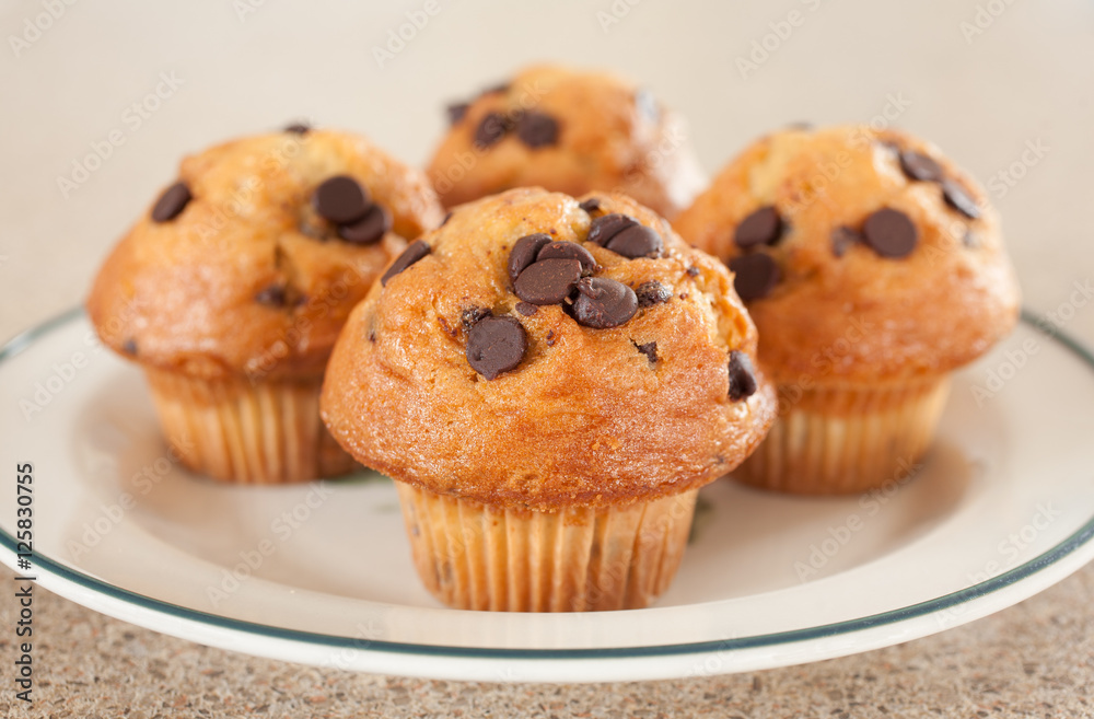 Chocolate chip muffins on plate. Chocolate chip muffins on plate.
