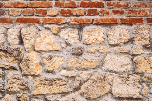 Stone wall with red bricks