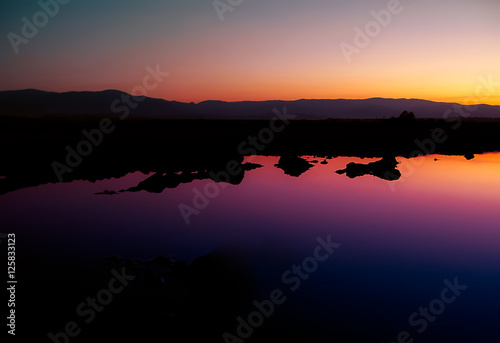 Obraz na plátne Sunset reflections in water