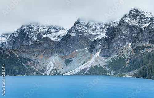 emerald lake under mountains peaks © sergejson