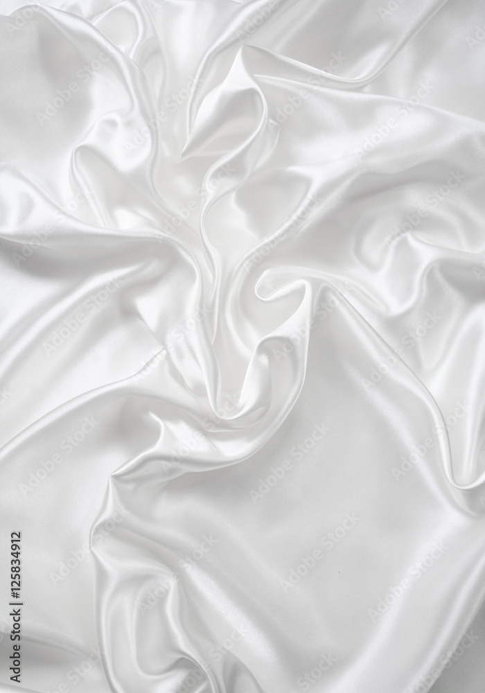 Fototapeta premium Smooth elegant white silk as wedding background