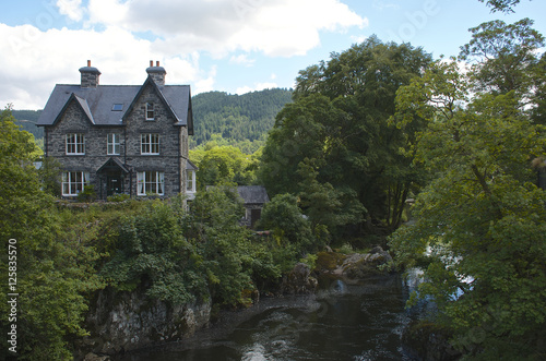 House beside a river, summers day in Beytws y coed photo
