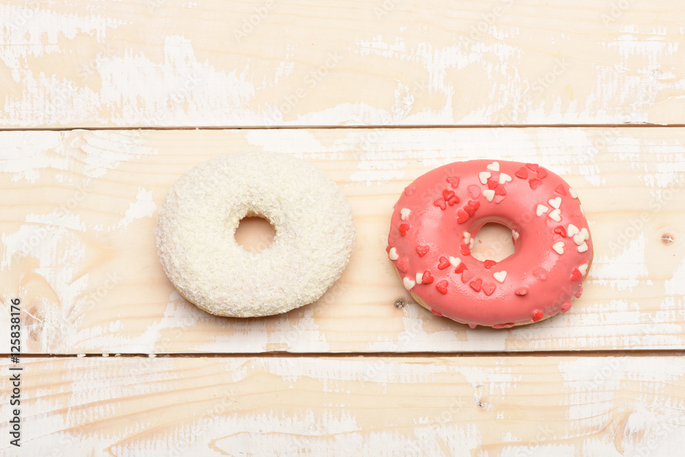 Glazed donuts on vintage background