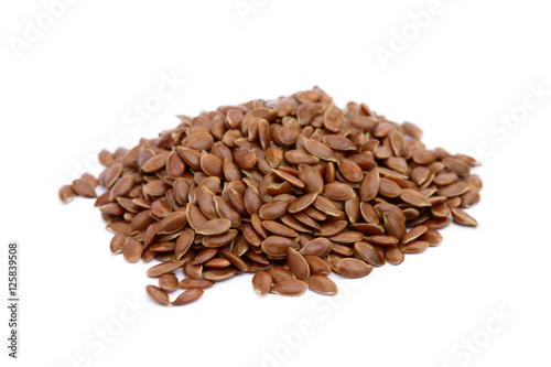 Pile of flax seed isolated on white background