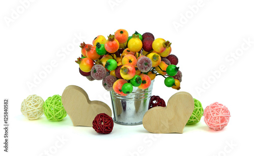 Festive composition with hearts and frozen berries. Isolated.