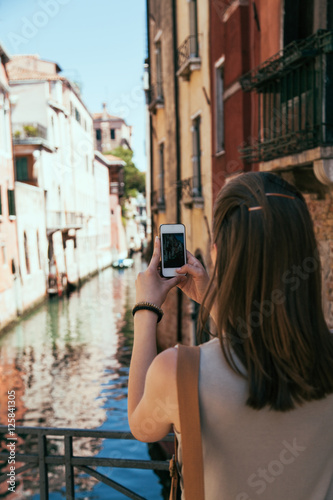 Young girl take a photo in Venice  Italy. Beautiful place