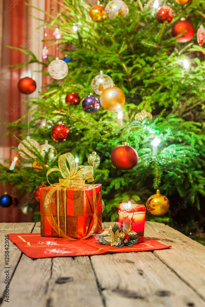 Decorated and illuminated Christmas tree on indistinct, blurred and  fairytale background.
