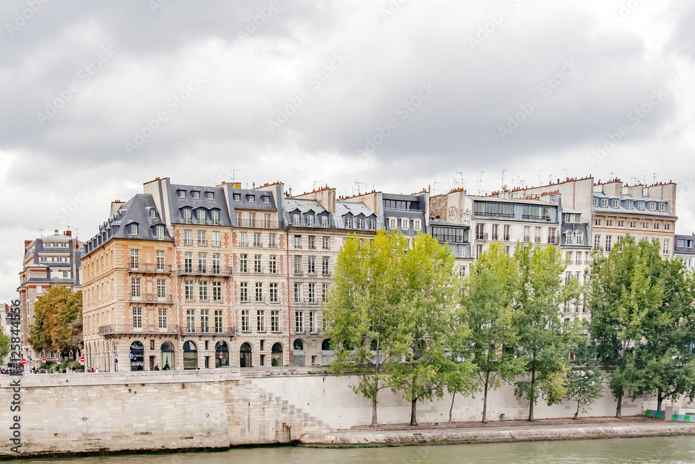 The architecture of Paris seen from the Sena River in downtown Paris in France, Europe.