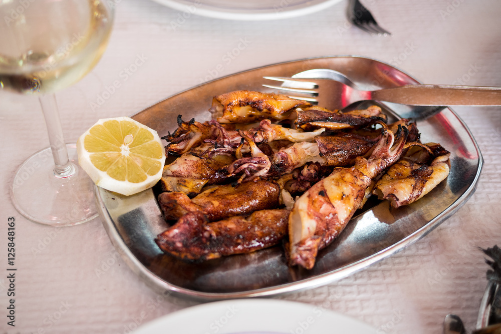 Fresh portuguese seafood: grilled squids