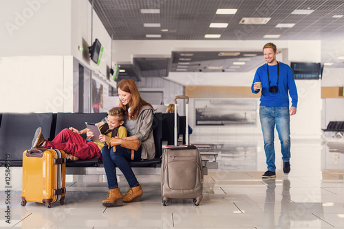 Family waiting for departure at airport