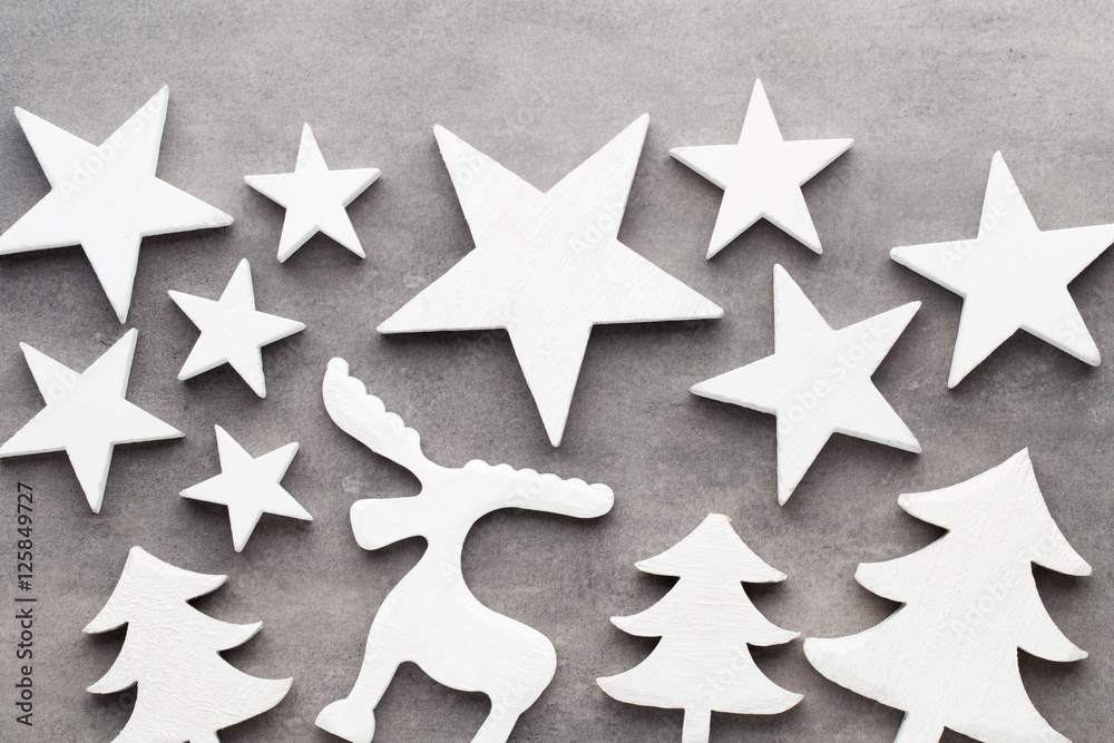 Christmas background. White tree decorations on a gray backgroun Christmas background. White tree decorations on a gray backgroun