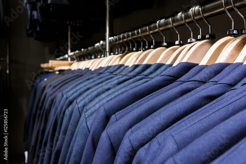 Blazer Jacket on Rack in Store Men Fashion Wooden Hangers Clothe