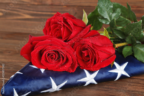 Red roses on American flag  closeup