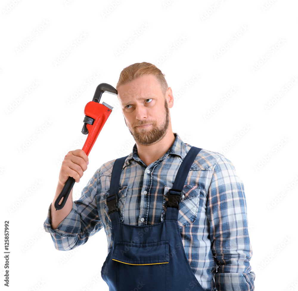 Portrait of funny plumber with pipe wrench isolated on white Portrait of funny plumber with pipe wrench isolated on white
