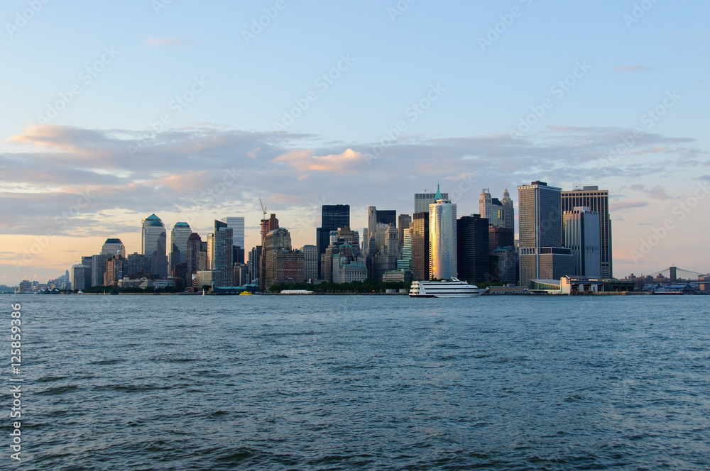 Manhattan skyline from bay just before sunset