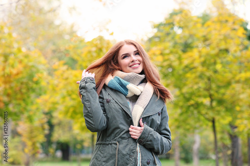 Beautiful young woman in a autumn park