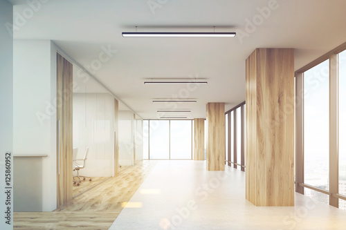 Office with wooden columns and conference rooms, toned © ImageFlow