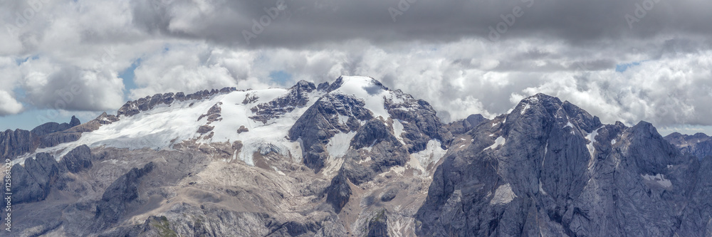 Panoramic at the highest mountain of the Dolomites, the snowy Marmolata, as seen from the Piz Boe at the Passo Pordoi.
