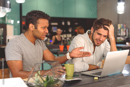 Two friends spending time in cafe