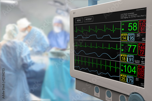 Intensive care unit (ICU) LCD monitor with an ongoing surgery in background