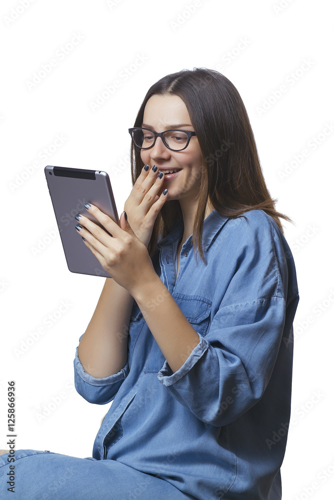 Emotional surprised female woman with digital tablet is looking