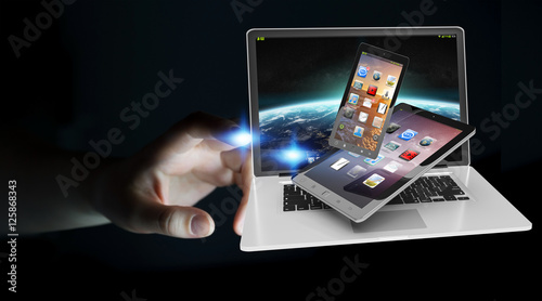 Businessman touching laptop phone and tablet with his finger 3D