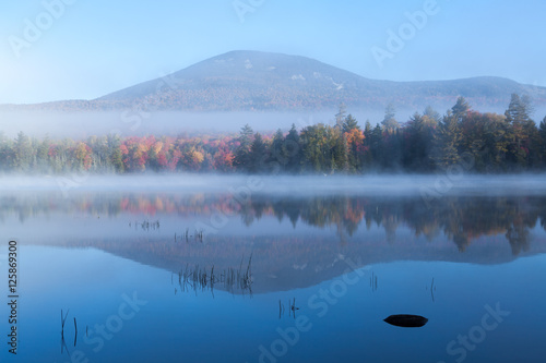 Blue Mountain reflecting on misty Lake Durant at sunrise in autumn © John Aylward