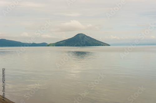 Momotombo and Momotombito volcanoes across Lake Managua photo