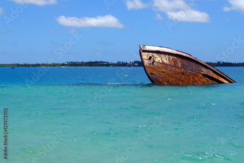 Shipwreck off the coast of Pangaimotu island near Tongatapu isla photo