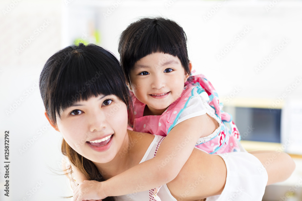 closeup of happy little girl and mother closeup of happy little girl and mother