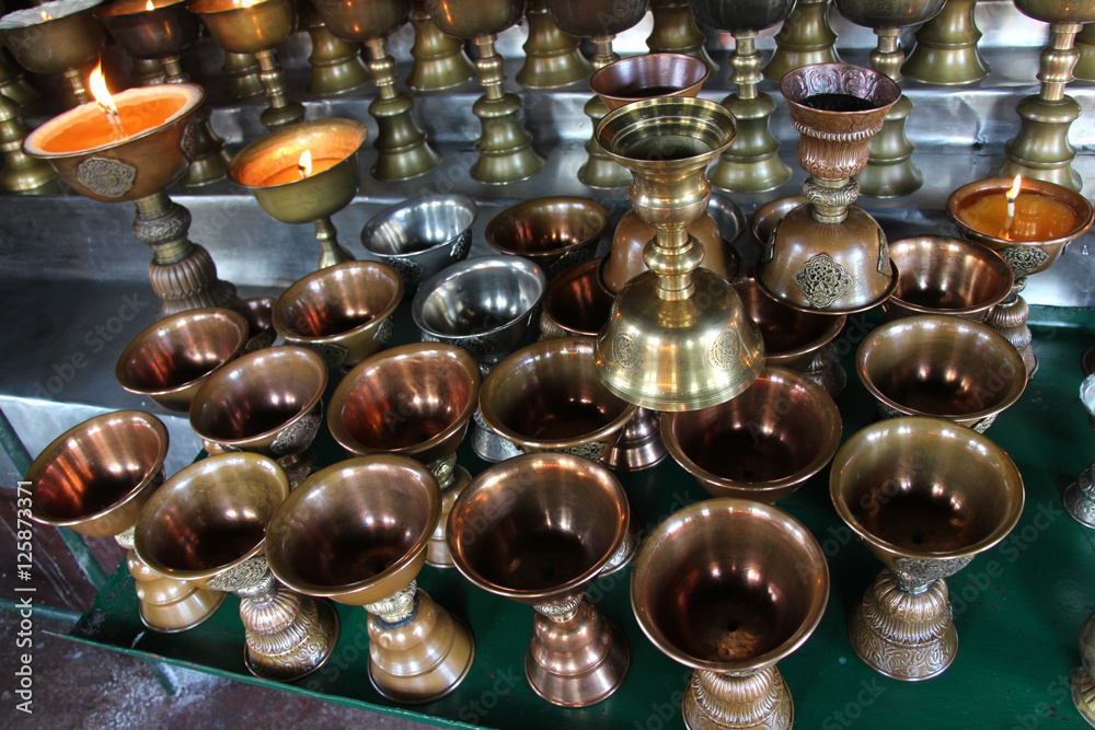 Brushed metal pot. Preparing for candle in a Temple. Brushed metal pot. Preparing for candle in a Temple.