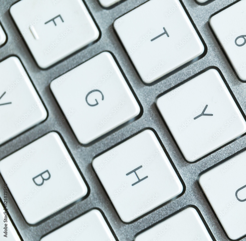 Close up of white wireless aluminum keyboard Close up of white wireless aluminum keyboard