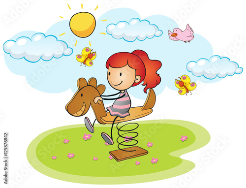 Little girl playing on rocking horse