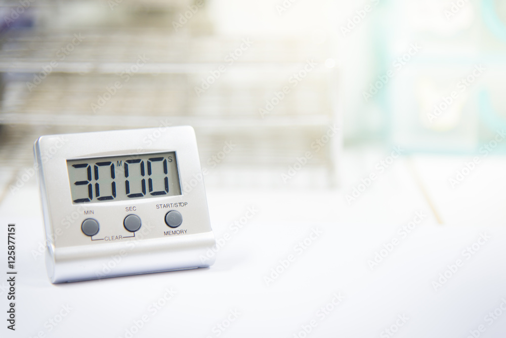 Timer count down laboratory equipment in over white tone. Timer count down laboratory equipment in over white tone.