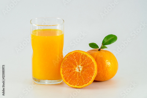 Orange juice and slices of orange isolated on white