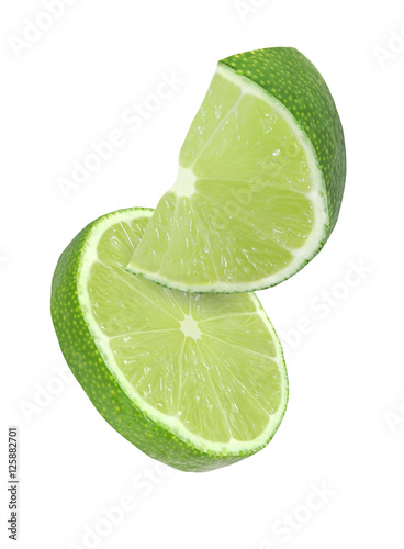 hanging, falling and flying piece of lime fruits isolated on white background with clipping path
