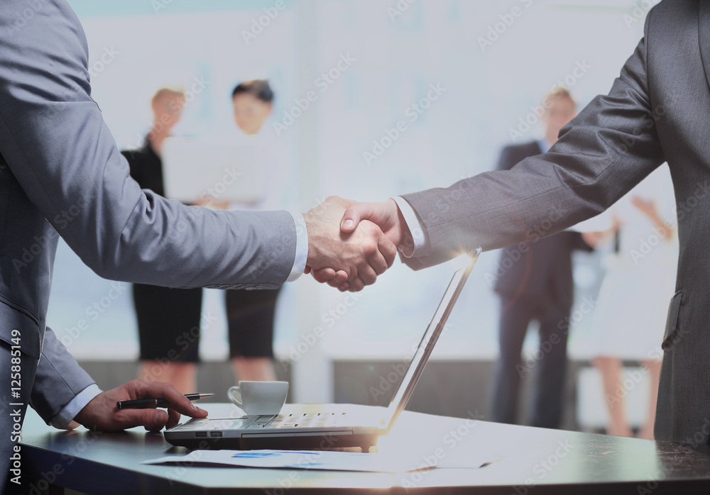 Business man shaking hand to partner Business man shaking hand to partner