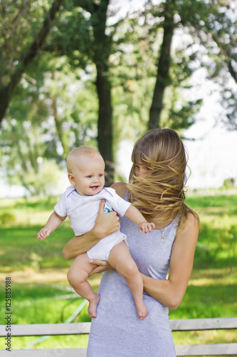 Happy young mother with a little daughter 