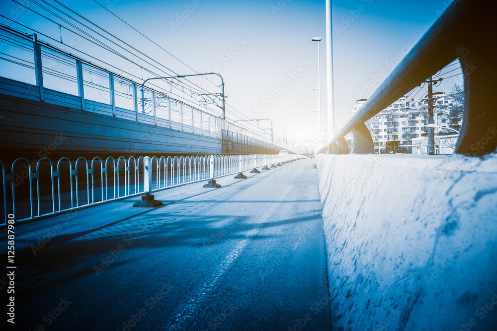 empty asphalt road with cityscape and skyline of Shanghai in China. empty asphalt road with cityscape and skyline of Shanghai in China.