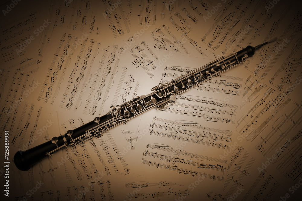 Obraz premium Oboe with music sheet notes classical musical instruments