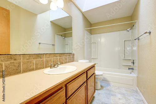 Bathroom interior with bath and shower combination