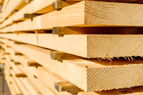 Corner parts of stacked lumber or timber. photo