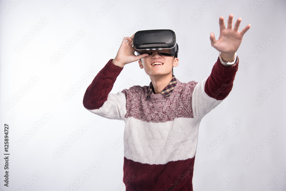 Man wearing virtual reality headset. Man wearing virtual reality headset.