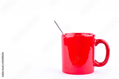 red coffee or tea cup and spoon on white background drink isolated
