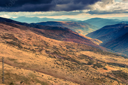 Scenic view of mountains, autumn landscape with colorful hills. Filtered image:cross processed vintage effect.